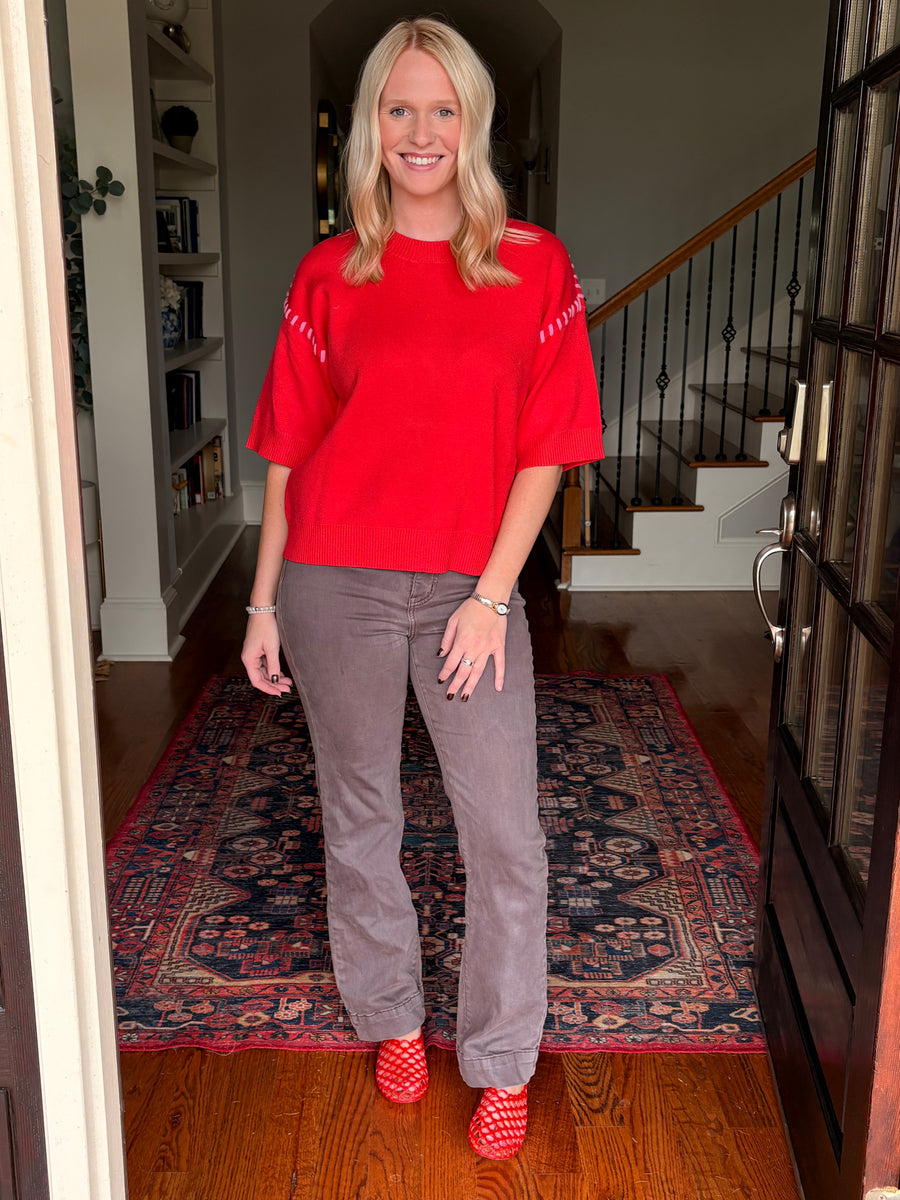 Red shirt with pink stitching