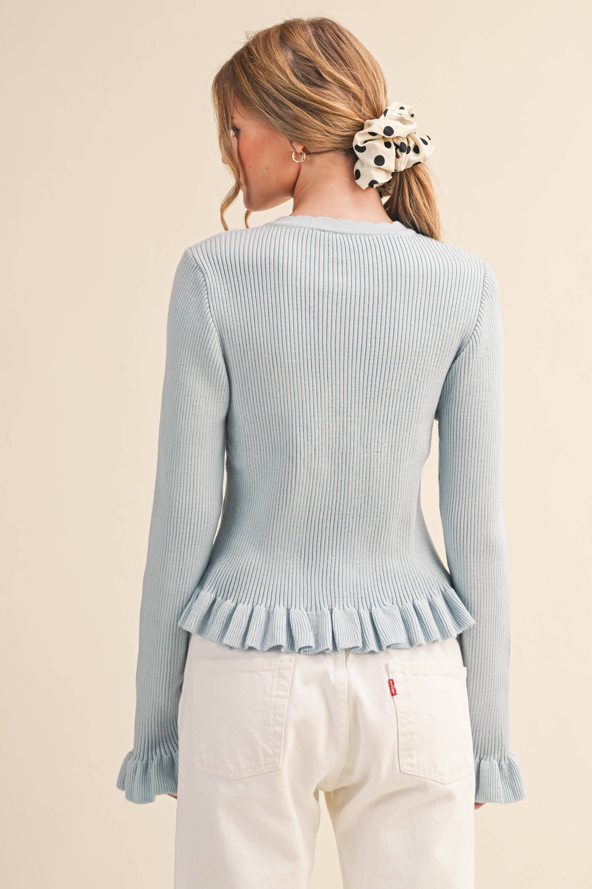 RUFFLE HEM RIBBED KNIT SWEATER