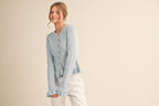 RUFFLE HEM RIBBED KNIT SWEATER