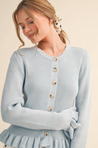 RUFFLE HEM RIBBED KNIT SWEATER